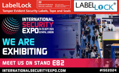 Image with a red header with white text saying ‘LabelLock Tamper Evident Security Labels, Tape and Seals’ next to the NPSA (National Protective Security Authority) and LabelLock logos. Beneath that is a raised viewpoint image of an exhibition hall with a variety of stands and visitors walking the aisles and overlaid that image to the left hand side is the International Security Expo logo with the date ‘24-25 Sept 2024’ and venue ‘Olympia, London’ below it, followed by larger text saying ‘We are exhibiting. Meet us on Stand E82’ and the website address of ‘Internationalsecurityexpo.com’.