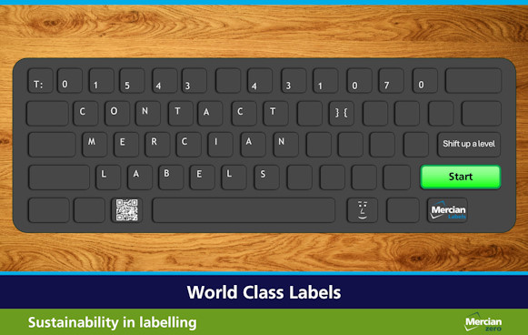 Image shows a black keyboard sat on a wooden surface, but instead of the usual characters (in white text) on the keyboard each button spells out: T: 01543 431070 CONTACT MERCIAN LABELS. There are then three large buttons to the right hand side. The first states ‘Shift up a level’, below that, the largest button is bright green and has the word ‘Start’ written on it in Black and below that is a button with the Mercian Labels logo on it. To the left of the space bar is a button with a QR code on it which links to the Mercian Labels website.