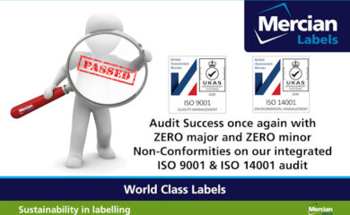 A 3D figure holds a magnifying glass with a red "PASSED" stamp shown in the centre. Beside it are ISO 9001 and ISO 14001 certification logos from the British Assessment Bureau. Text reads: "Audit Success once again with ZERO major and ZERO minor Non-Conformities on our integrated ISO 9001 & ISO 14001 audit." The Mercian Labels logo appears in the top right, and at the bottom are banners reading "World Class Labels" and "Sustainability in labelling."
