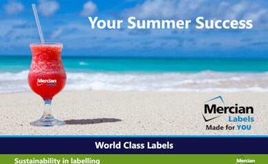 Image featuring a tropical beach with turquoise ocean waves and a blue sky with scattered clouds. In the foreground, a red frozen drink in a glass with a straw sits on the sand. The glass is labelled “Mercian Labels.” White text at the top reads “Your Summer Success.” The Mercian Labels logo appears on the right. A blue banner at the bottom says “World Class Labels,” and a green banner below it reads “Sustainability in labelling” with a small “Mercian Zero” logo.