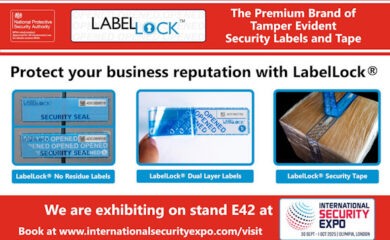 Promotional banner for LabelLock®, a premium brand of tamper-evident security labels and tape, approved for UK Government use by the National Protective Security Authority. The banner headline reads "Protect your business reputation with LabelLock®." Three product images are displayed: LabelLock® No Residue Labels, LabelLock® Dual Layer Labels, and LabelLock® Security Tape. At the bottom, a red banner announces LabelLock’s exhibition at stand E42 at the International Security Expo, taking place from 30 September to 1 October 2025 at Olympia, London. The event logo is also shown.